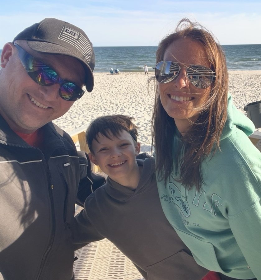Josh Drew with his wife and son on the beach